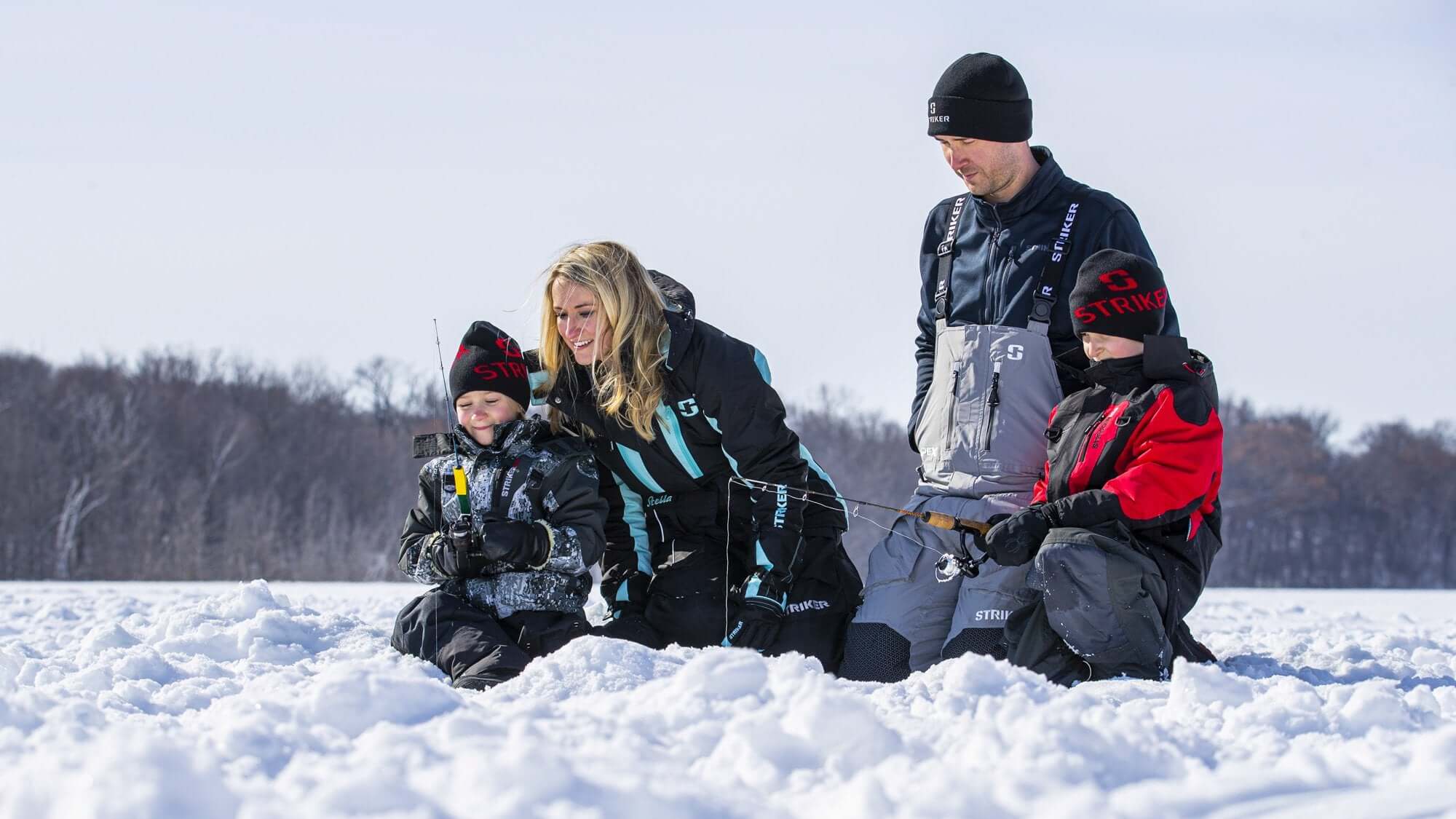 Two Children and Parents on a Lake Ice Fishing Wearing StrikerICE Suits